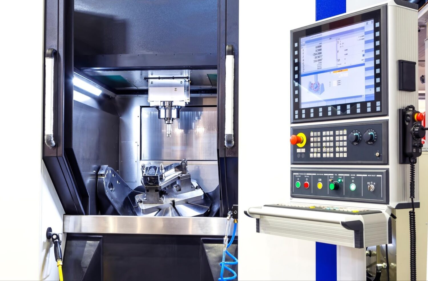 CNC machine with door open and screen for programming
